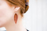 English Tan Large Leather Petal Earrings shown on model's ear