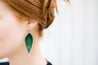 Emerald Large Leather Petal Earrings shown on model's ear