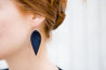 Midnight Large Leather Petal Earrings shown on model's ear