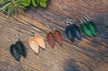 Small Leather Petal Earrings shown in five colors: Espresso, Natural, English Tan, Midnight & Emerald