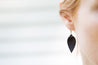 Espresso Small Leather Petal Earrings shown on model's ear