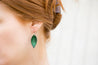 Emerald Small Leather Petal Earrings shown on model's ear