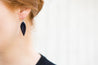 Midnight Small Leather Petal Earrings shown on model's ear
