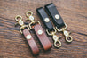 Mahogany and black trigger snap key fobs shown in two widths: 3/4" and 1"