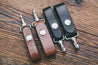 Mahogany and black spring clip key fobs shown in two widths: 3/4" and 1"
