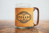 Handcrafted mug created from thick leather sleeve around a glass canning jar. Spokane, Washington design stamped into leather sleeve.