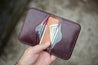 Interior of six pocket handcrafted Cascadia wallet constructed with Mahogany leather