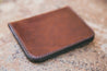 Flat-lay of rich brown handcrafted leather wallet