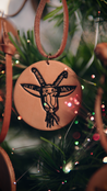 Decorative leather ornament with Spokane Garbage Goat head design on a Christmas tree.