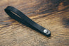 Hand-crafted guitar neck adapter strap in black with nickel hardware. 