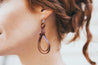 English Tan Braided Knot Earrings shown on model's ear