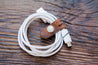 Charge cord wrap neatly and secured with leather cord keeper