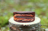 Leather cuff with hand carved feather design 