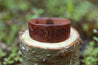 Leather cuff with hand carved scrollwork design 