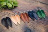 Large Leather Petal Earrings shown in five colors: Espresso, Natural, English Tan, Midnight and Emerald