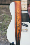 Details of hand carved and tooled Silent Forest on leather guitar strap