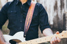 Guitar player modeling leather Silent Forest strap