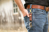 Man with leather key fob snapped on his belt loop using trigger snap 