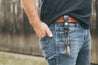 Man wearing black leather HK clip key fob on his belt 