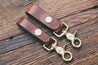 Mahogany leather key fobs with solid brass trigger snap, shown in two widths: 3/4" and 1"