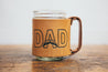 Mug made from leather sleeve around glass canning jar. Design shows the word "DAD" with mustache. 